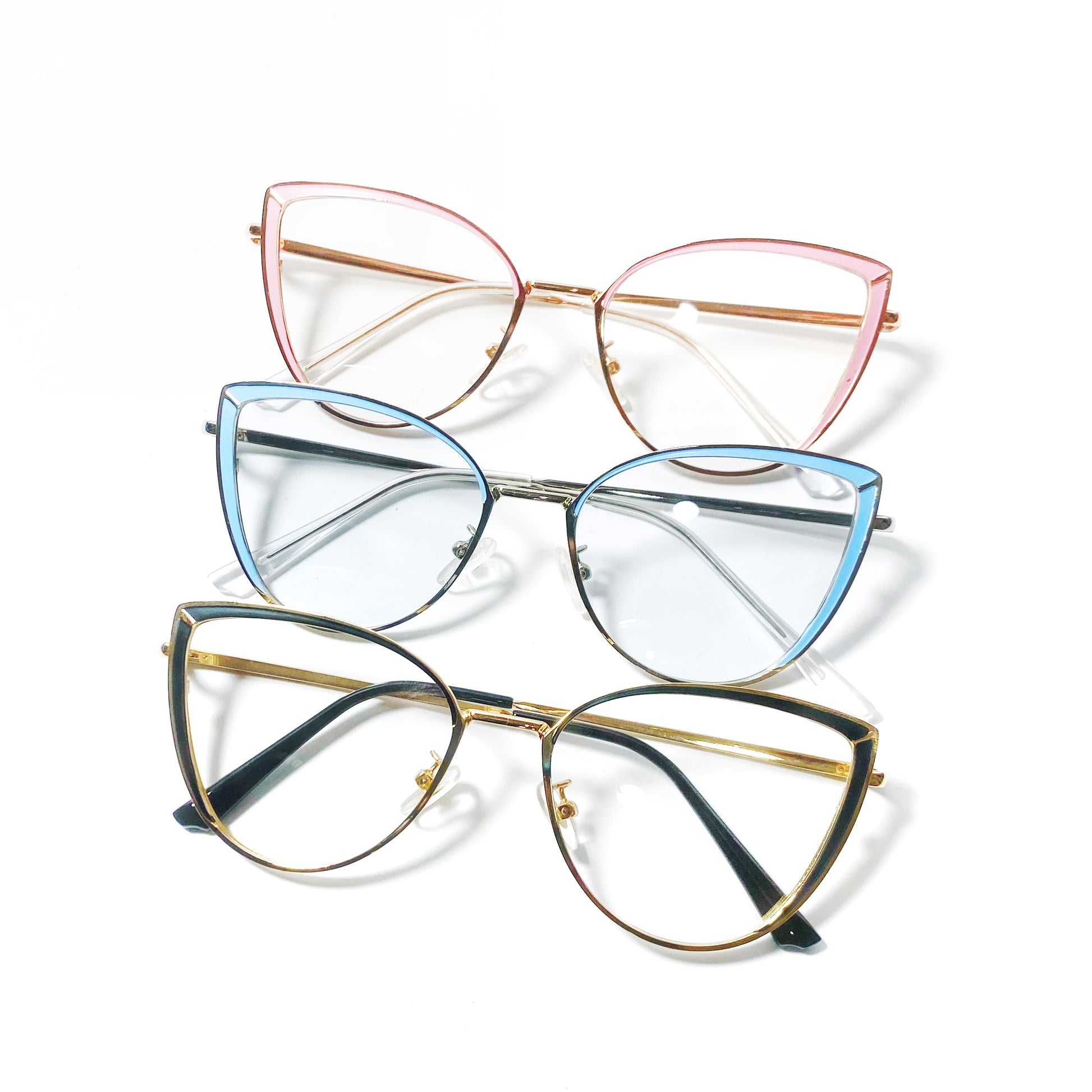 Three pairs of cat-eye glasses with different colored frames on a white background